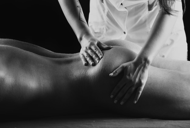 Черкаси man-back-butt-massage-from-masseur-massage-back-buttocks-male-getting-relax-massage-s